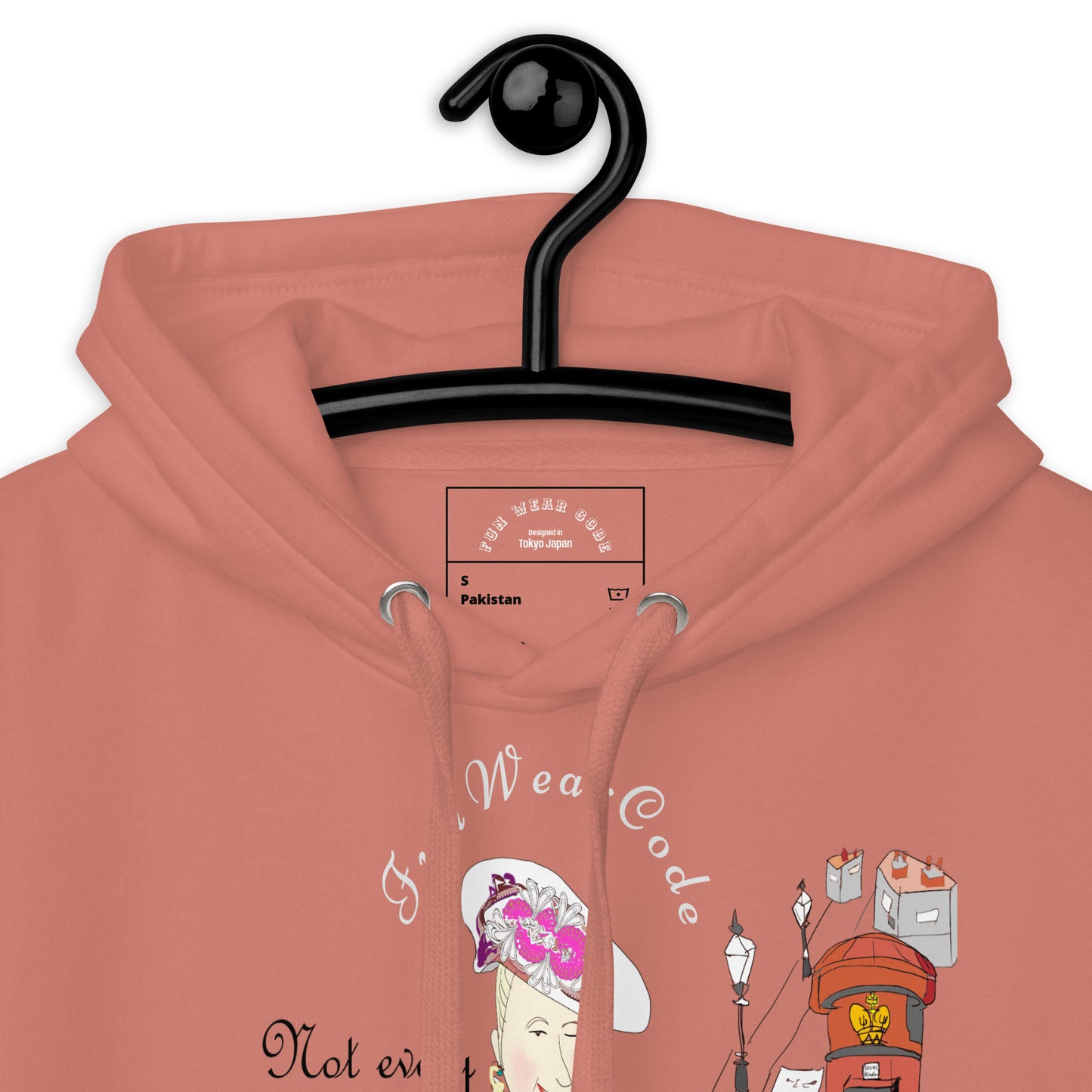Coral hoodie with graphic design on a hanger against a white background