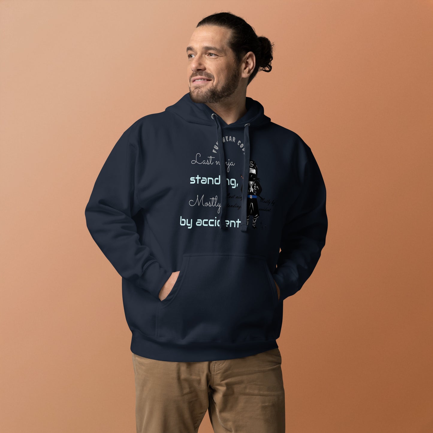 Man wearing a navy hoodie with text on a brown background