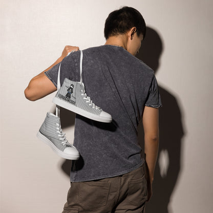 Person holding a pair of gray high-top sneakers with a ninja graphic and 'Fun Wear Code' text logo against a plain background